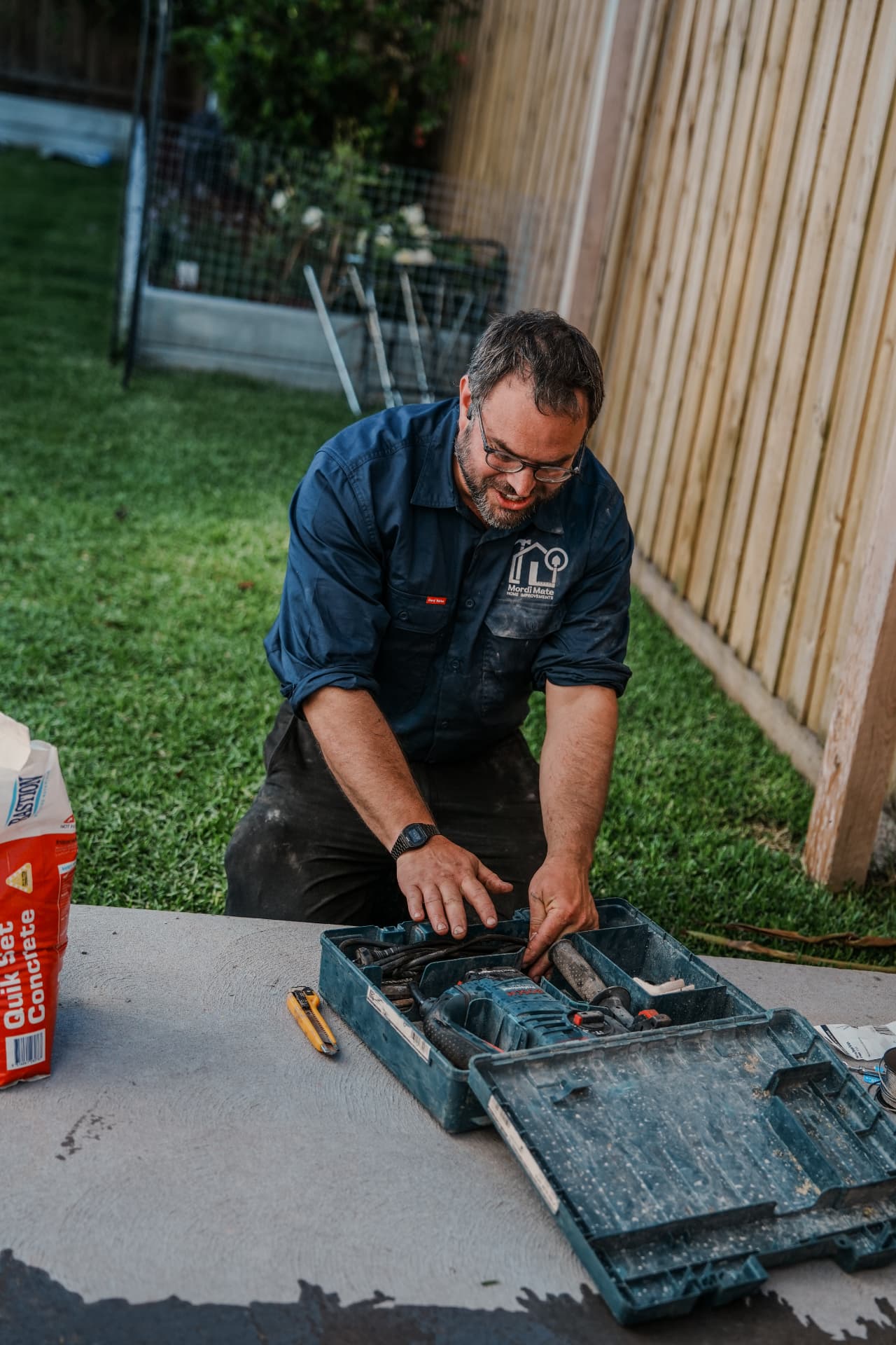 Tradesman setting up tools on a job site