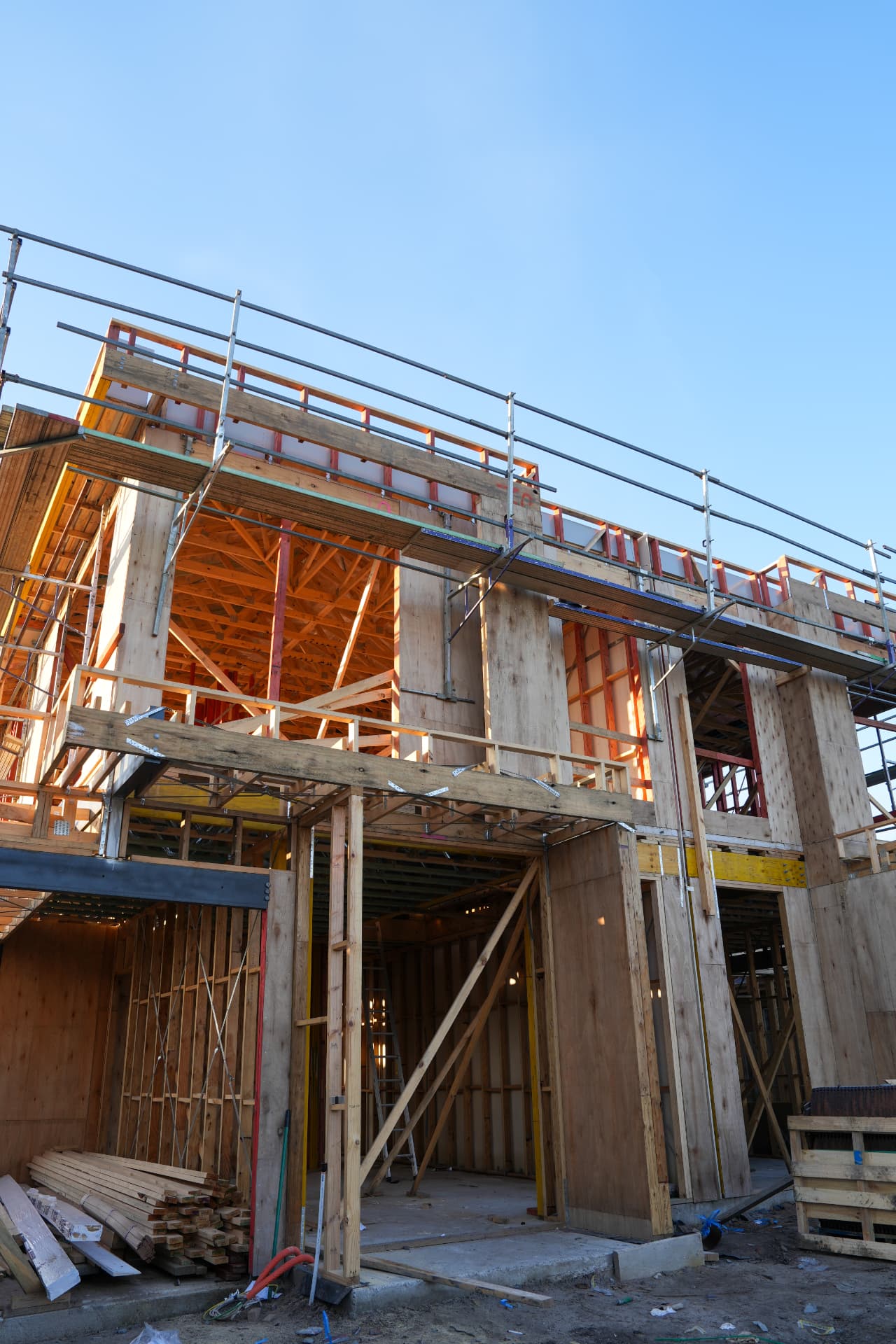 Two storey home under construction with scaffolding