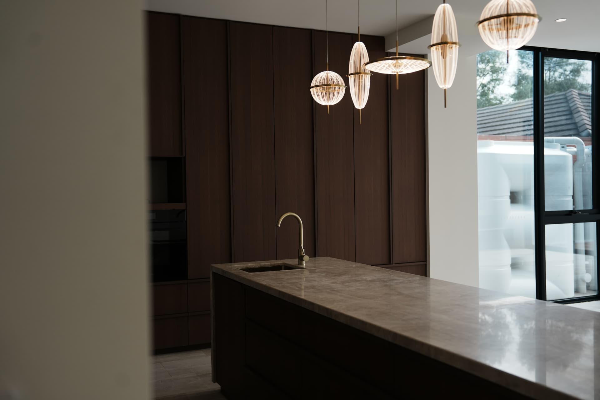 Designer kitchen island with pendant lighting