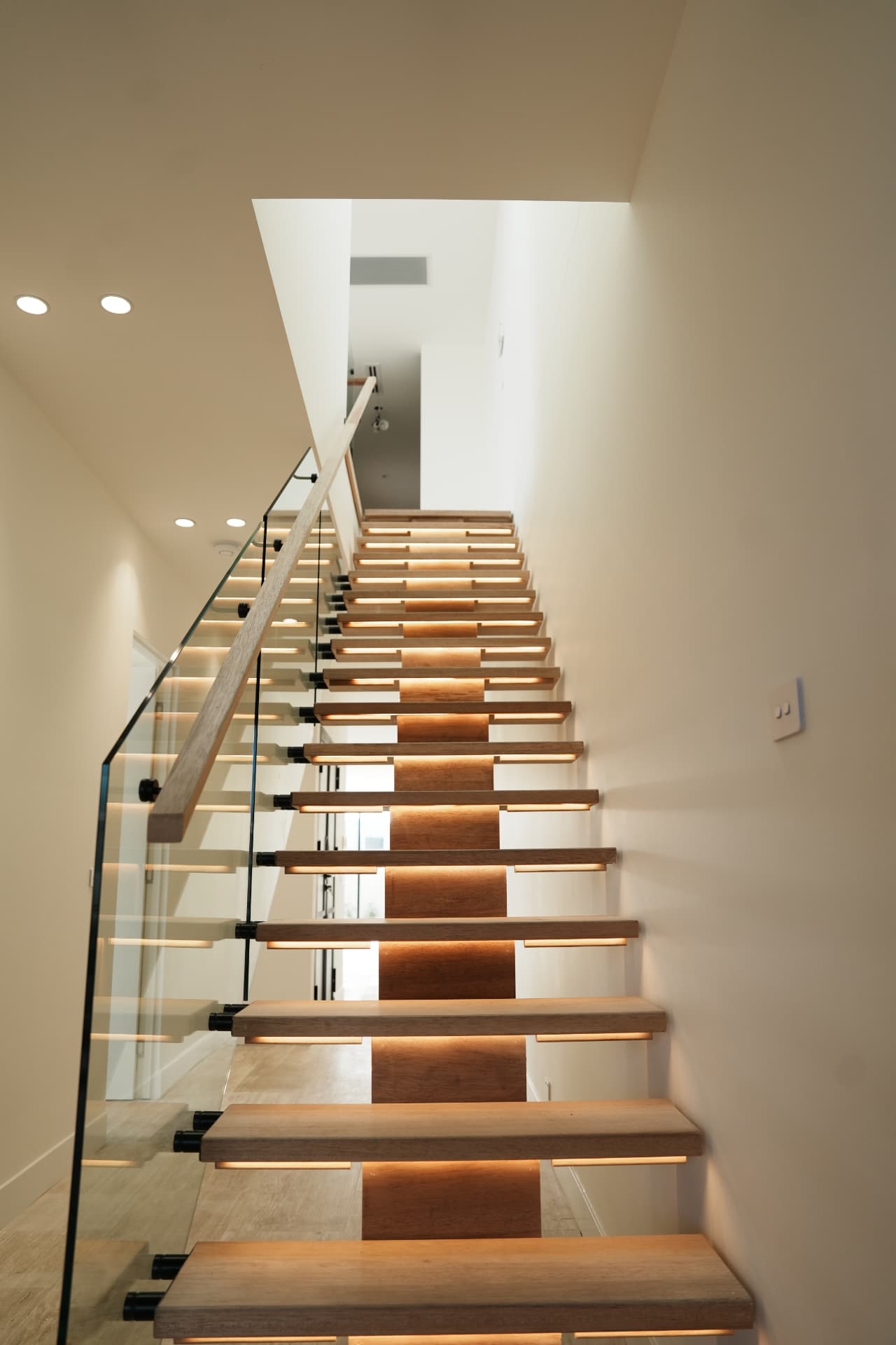 Floating timber staircase with LED lighting